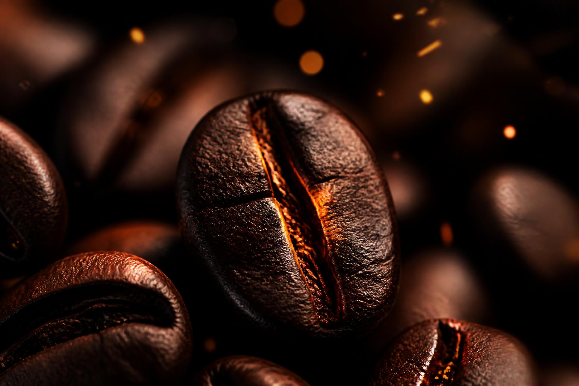 Roasted coffee beans with glowing embers